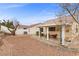 Spacious backyard with a covered patio, offering a perfect spot for outdoor relaxation and entertaining at 6611 Cinnabar Coast Ln, North Las Vegas, NV 89084