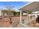 Relaxing backyard featuring low-maintenance landscaping, a covered patio, and a tranquil outdoor seating area at 6611 Cinnabar Coast Ln, North Las Vegas, NV 89084