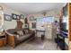 Comfortable bedroom features carpeted floors, a futon, and bright natural light at 6611 Cinnabar Coast Ln, North Las Vegas, NV 89084