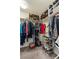 Walk-in closet with shelving, hanging storage, and ample space for organization at 6611 Cinnabar Coast Ln, North Las Vegas, NV 89084