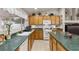 Bright kitchen features ample counter space, wood cabinets, and modern appliances at 6611 Cinnabar Coast Ln, North Las Vegas, NV 89084