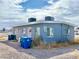 Charming single-story exterior with blue paint and a gravel front yard, perfect for low-maintenance living at 703 Madison Ave, Las Vegas, NV 89106