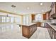 Kitchen island with marble countertops and stainless steel appliances at 7293 Iron Oak Ave, Las Vegas, NV 89113