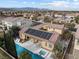 Home with a sparkling pool and spa, solar panels, and a covered patio in a lush planned community at 7307 Iron Oak Ave, Las Vegas, NV 89113