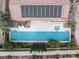Overhead shot of a property featuring a long pool, hot tub, solar panels, manicured landscaping, and a backyard patio at 7307 Iron Oak Ave, Las Vegas, NV 89113