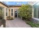 Outdoor patio with mature landscaping, providing a serene and private backyard retreat at 7307 Iron Oak Ave, Las Vegas, NV 89113
