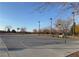 Outdoor basketball court with hoops, benches, and trees, offering recreational space for residents at 7307 Iron Oak Ave, Las Vegas, NV 89113