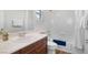 Well-lit bathroom featuring a vanity with white countertop and a shower-tub combo at 7307 Iron Oak Ave, Las Vegas, NV 89113