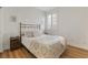 Comfortable bedroom with hardwood floors, large windows and simple decor at 7307 Iron Oak Ave, Las Vegas, NV 89113