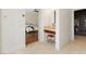 Bright hallway featuring a bedroom with hardwood floors, a bed and a walk in closet at 7307 Iron Oak Ave, Las Vegas, NV 89113