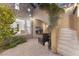 Private courtyard with stone fireplace, brick floors, and outdoor seating, perfect for relaxing at 7307 Iron Oak Ave, Las Vegas, NV 89113