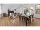 Spacious dining area with wood floors, comfortable seating, and bright windows at 7307 Iron Oak Ave, Las Vegas, NV 89113