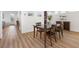 Bright dining room features wood floors, modern decor, and a stylish table set at 7307 Iron Oak Ave, Las Vegas, NV 89113