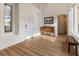 Bright entryway with wood floors, white walls, and a vaulted ceiling at 7307 Iron Oak Ave, Las Vegas, NV 89113