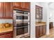 Modern kitchen featuring stainless steel appliances and dark wood cabinets at 7307 Iron Oak Ave, Las Vegas, NV 89113