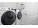 Modern laundry room equipped with Samsung washer and dryer, plus lots of storage space at 7307 Iron Oak Ave, Las Vegas, NV 89113