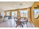 Bright dining area with a round table, stylish chairs, and sliding glass doors to the outdoor patio at 816 Ruby Sedona Ave # Lot 155, North Las Vegas, NV 89081