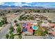 Property featuring a pool, landscaping, solar panels and expansive views at 8880 W La Mancha Ave, Las Vegas, NV 89149