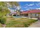 Private backyard with a refreshing pool, covered patio, and well-maintained lawn for outdoor living at 8880 W La Mancha Ave, Las Vegas, NV 89149