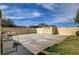 Expansive backyard with concrete patio, shed, and a view of the surrounding landscape at 8880 W La Mancha Ave, Las Vegas, NV 89149