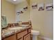 Powder room features a marble countertop, modern fixtures, and decorative wall art at 8880 W La Mancha Ave, Las Vegas, NV 89149