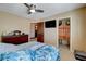 Bedroom with a TV, a closet, and a dresser with decor at 8880 W La Mancha Ave, Las Vegas, NV 89149