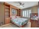 Bedroom with a built-in headboard and shelving at 8880 W La Mancha Ave, Las Vegas, NV 89149