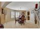 Charming dining area features a chandelier, natural light, and stylish decor at 8880 W La Mancha Ave, Las Vegas, NV 89149