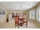 Charming dining area features a chandelier, natural light, and stylish decor at 8880 W La Mancha Ave, Las Vegas, NV 89149
