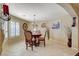 Charming dining area features a chandelier, natural light, and stylish decor at 8880 W La Mancha Ave, Las Vegas, NV 89149