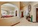 Arched entry to the game room with a pool table and decorated with plants at 8880 W La Mancha Ave, Las Vegas, NV 89149