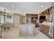 Kitchen with a large island, stainless steel appliances, and modern lighting at 8880 W La Mancha Ave, Las Vegas, NV 89149