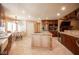 Open kitchen featuring an island, granite countertops, and a breakfast nook at 8880 W La Mancha Ave, Las Vegas, NV 89149