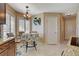 Eat-in kitchen featuring granite countertops, chandelier, and stainless steel appliances at 8880 W La Mancha Ave, Las Vegas, NV 89149