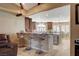 Eat-in kitchen featuring granite countertops, barstool seating, and stainless steel appliances at 8880 W La Mancha Ave, Las Vegas, NV 89149