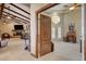 Open living room with ceiling fan and connecting doorway at 8880 W La Mancha Ave, Las Vegas, NV 89149