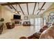 Inviting living area with a stone fireplace, comfortable seating, and open layout for easy entertaining at 8880 W La Mancha Ave, Las Vegas, NV 89149