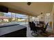 Inviting covered patio with ample seating, views of the pool, and a relaxing atmosphere for entertaining at 8880 W La Mancha Ave, Las Vegas, NV 89149