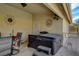 Comfortable covered patio with hot tub, perfect for relaxing and enjoying the outdoor ambiance at 8880 W La Mancha Ave, Las Vegas, NV 89149