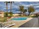 Inviting pool and spa surrounded by a spacious patio, perfect for relaxing and entertaining in style at 8880 W La Mancha Ave, Las Vegas, NV 89149