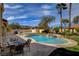 Entertain in style in this backyard with a sparkling pool, spa, and comfortable patio seating at 8880 W La Mancha Ave, Las Vegas, NV 89149