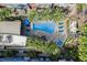 Overhead view of the community pool, palm trees, lounge chairs, and hot tub at 9050 W Tropicana Ave # 1178, Las Vegas, NV 89147