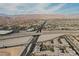 Aerial view of the community showcasing the landscape, nearby highway, and mountains in the distance at 9050 W Tropicana Ave # 1178, Las Vegas, NV 89147