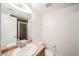 A bathroom vanity with updated countertop, a sink, and a large mirror, and a walk-in shower nearby at 9050 W Tropicana Ave # 1178, Las Vegas, NV 89147
