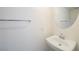 Clean bathroom with a floating sink, mirror, towel rack and white paint at 9050 W Tropicana Ave # 1178, Las Vegas, NV 89147