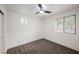 This bedroom features plush carpet, a ceiling fan, and a large window that provides great natural light at 9050 W Tropicana Ave # 1178, Las Vegas, NV 89147