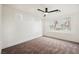 Bright bedroom featuring a ceiling fan, neutral carpet and multiple windows for natural light at 9050 W Tropicana Ave # 1178, Las Vegas, NV 89147