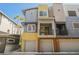 Charming multi-level townhome featuring attached garages and colorful, modern design at 9050 W Tropicana Ave # 1178, Las Vegas, NV 89147