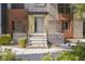 Inviting front entrance with stone steps, modern railings, and colorful exterior accents at 9050 W Tropicana Ave # 1178, Las Vegas, NV 89147