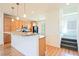 Bright kitchen featuring light wood cabinets, granite countertops, and a convenient breakfast bar at 9050 W Tropicana Ave # 1178, Las Vegas, NV 89147